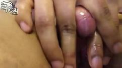 Ebony girl is rubbing her large clitoris
